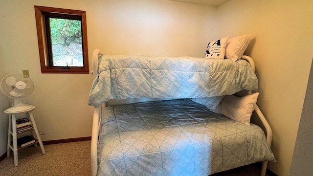 carpeted bedroom with baseboards