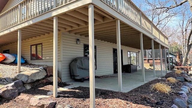 view of side of home featuring a patio