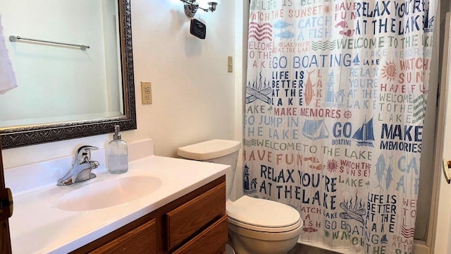 bathroom with toilet and vanity