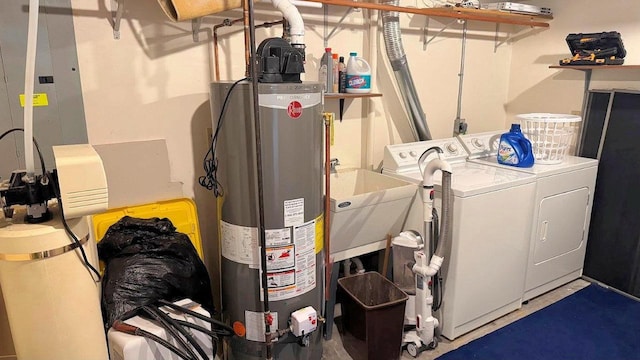 washroom featuring washer and dryer, laundry area, and gas water heater