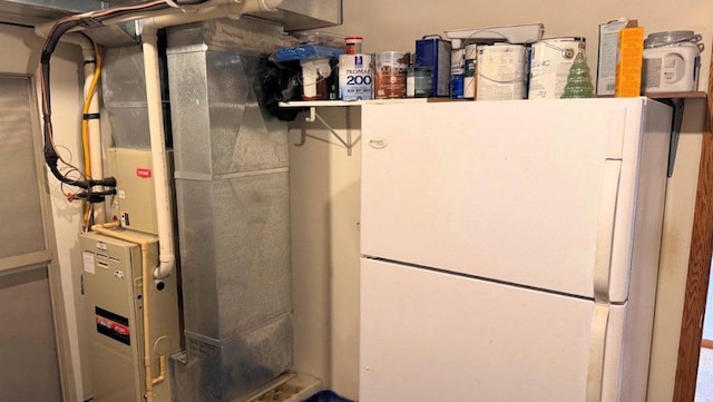 utility room with heating unit