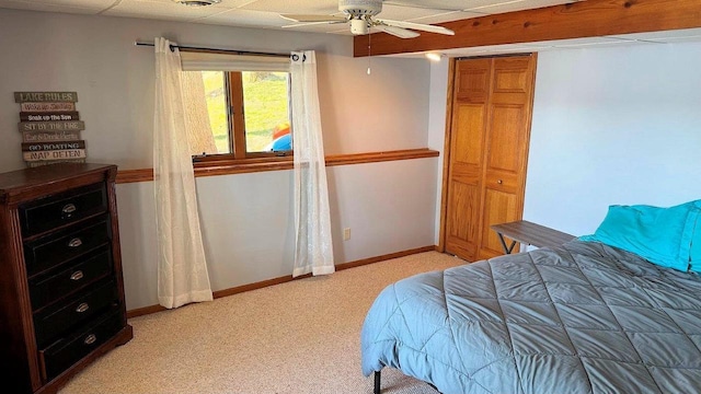 bedroom featuring visible vents, ceiling fan, baseboards, and light colored carpet