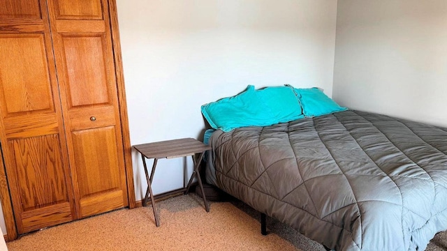 bedroom featuring light carpet