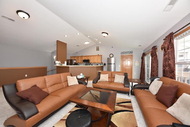 living room featuring light colored carpet, vaulted ceiling, visible vents, and recessed lighting