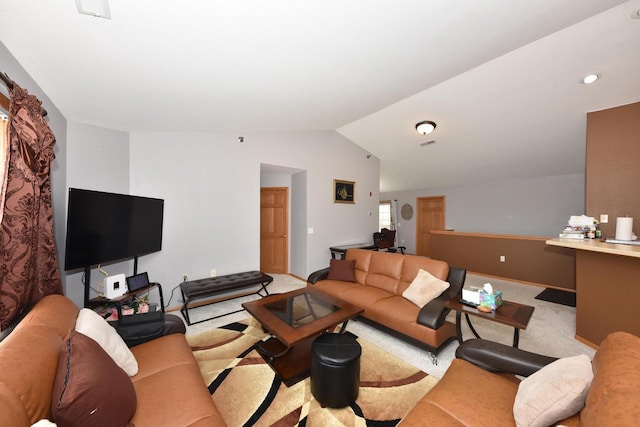 living room featuring baseboards, carpet, and vaulted ceiling
