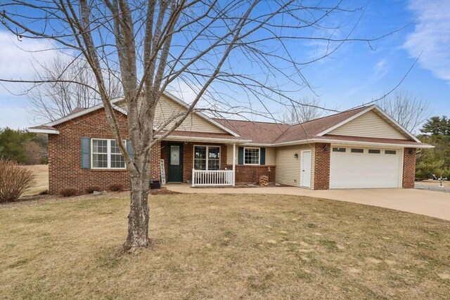 9521 County Road Ww, Wisconsin Rapids, WI 54494 - ranch-style house with driveway, a front lawn, brick siding, a porch, and a garage