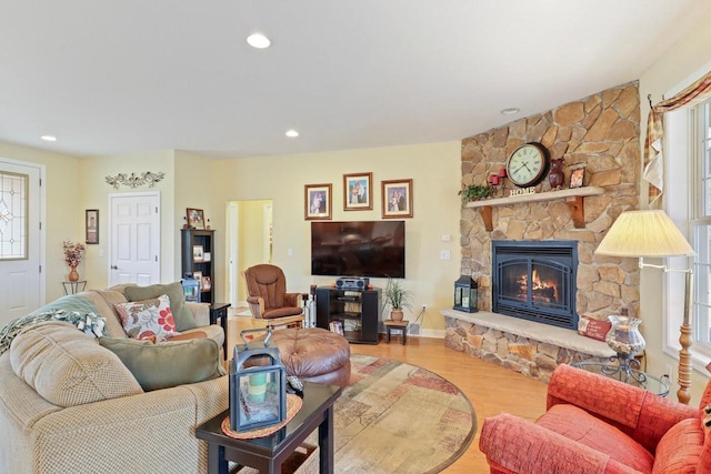 9521 County Road Ww, Wisconsin Rapids, WI 54494 - living room with a stone fireplace, baseboards, wood finished floors, and a healthy amount of sunlight