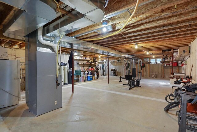 9521 County Road Ww, Wisconsin Rapids, WI 54494 - basement featuring freestanding refrigerator and heating unit