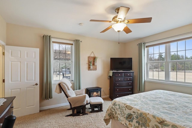9521 County Road Ww, Wisconsin Rapids, WI 54494 - carpeted bedroom featuring a ceiling fan, baseboards, and multiple windows