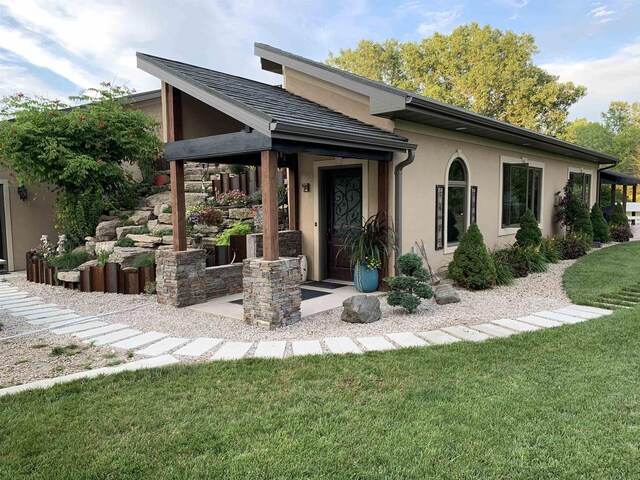 1545 County Rd I, Oshkosh, WI 54902 - view of front of home featuring stucco siding and a front lawn