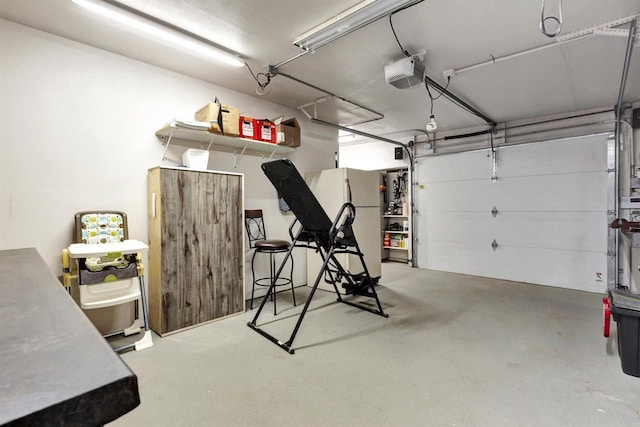 1545 County Rd I, Oshkosh, WI 54902 - garage featuring freestanding refrigerator and a garage door opener
