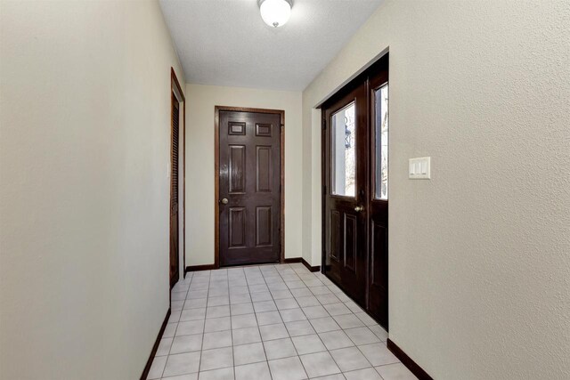 1545 County Rd I, Oshkosh, WI 54902 - doorway to outside with light tile patterned floors and baseboards
