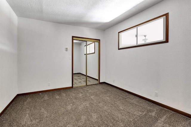 1545 County Rd I, Oshkosh, WI 54902 - carpeted spare room with a textured ceiling and baseboards