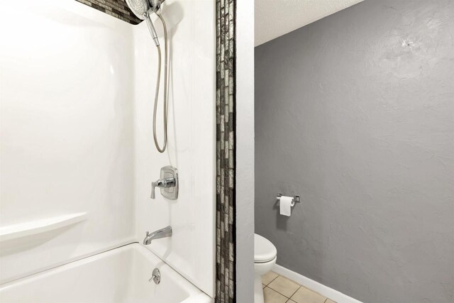 1545 County Rd I, Oshkosh, WI 54902 - bathroom featuring toilet, tile patterned floors, and tub / shower combination
