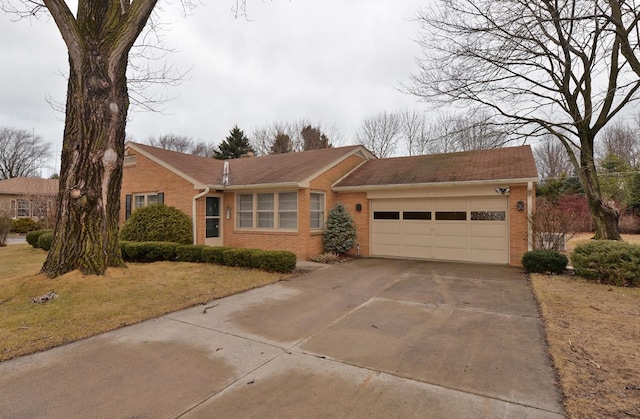 ranch-style house with brick siding, driveway, and a garage