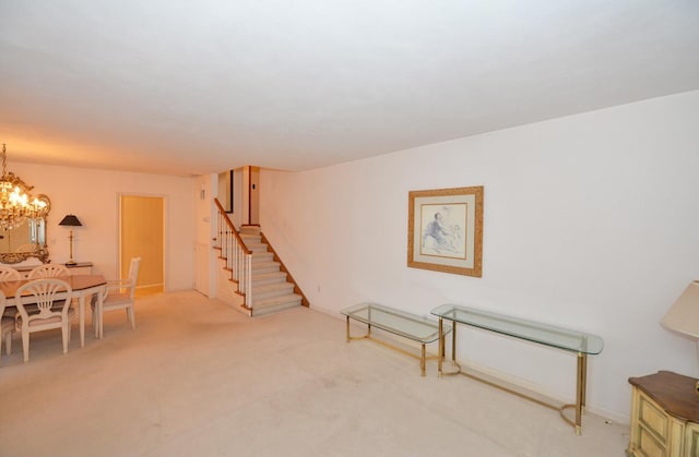 interior space featuring carpet flooring and a chandelier