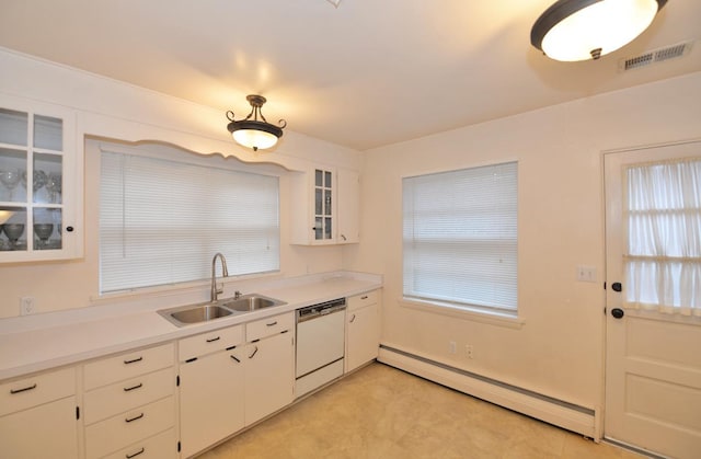 kitchen featuring visible vents, white dishwasher, a sink, a baseboard radiator, and light countertops