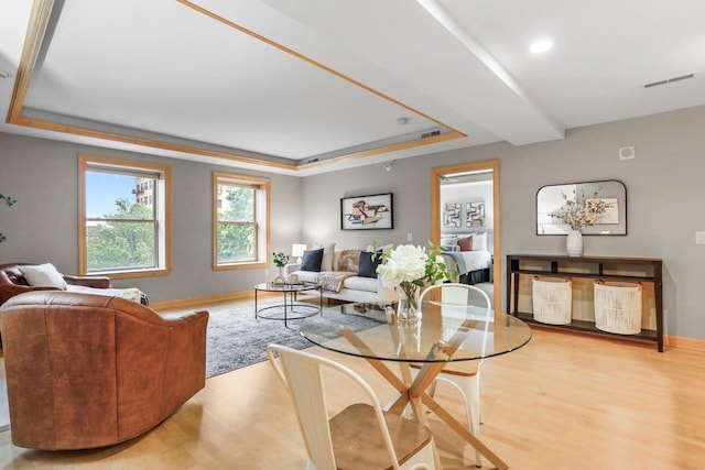 123 W Washington Ave Unit 306, Madison, WI 53703 - living room featuring a raised ceiling, wood finished floors, baseboards, and recessed lighting