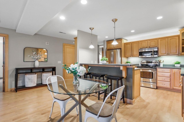 123 W Washington Ave Unit 306, Madison, WI 53703 - dining room featuring light wood finished floors and recessed lighting