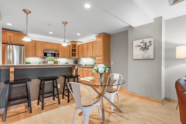 123 W Washington Ave Unit 306, Madison, WI 53703 - dining space featuring recessed lighting, light wood-style flooring, and baseboards