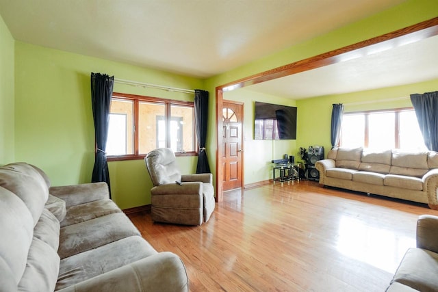 1001 Wisconsin Ave, North Fond Du Lac, WI 54937 - living area with a healthy amount of sunlight, wood finished floors, and baseboards