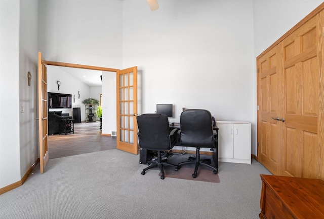 1495 Cattail Ln, Fond Du Lac, WI 54937 - carpeted office space with french doors, baseboards, and a towering ceiling