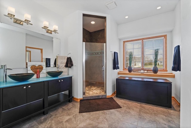1495 Cattail Ln, Fond Du Lac, WI 54937 - full bath with a sink, visible vents, baseboards, and a shower stall