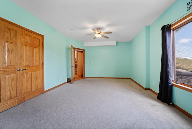 1495 Cattail Ln, Fond Du Lac, WI 54937 - unfurnished bedroom featuring visible vents, baseboards, and light carpet