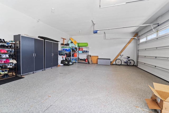 1495 Cattail Ln, Fond Du Lac, WI 54937 - garage featuring a garage door opener