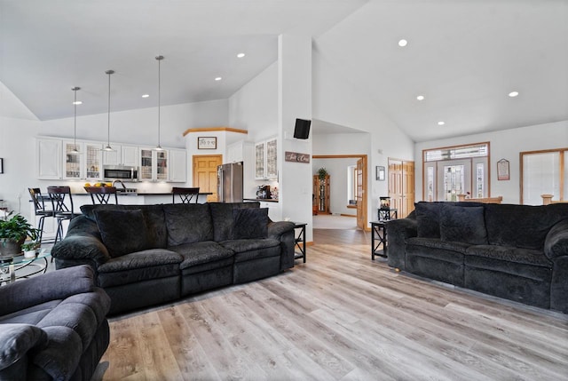 1495 Cattail Ln, Fond Du Lac, WI 54937 - living room featuring high vaulted ceiling, recessed lighting, and light wood-type flooring