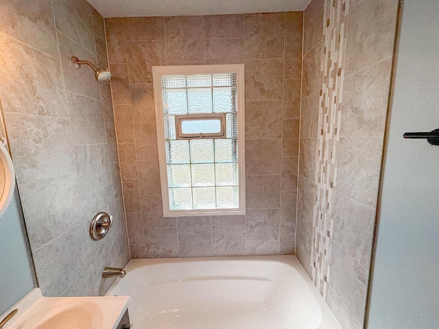 full bathroom with vanity, tub / shower combination, and a healthy amount of sunlight