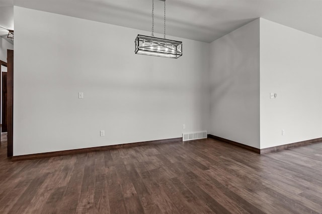 5096 N Milkweed Trl, Appleton, WI 54913 - unfurnished dining area with dark wood-style flooring, visible vents, and baseboards