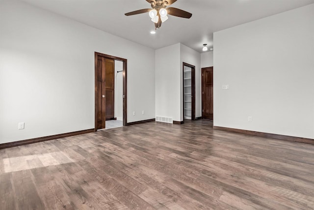 5096 N Milkweed Trl, Appleton, WI 54913 - spare room featuring visible vents, baseboards, a ceiling fan, and wood finished floors