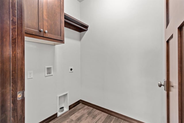 5096 N Milkweed Trl, Appleton, WI 54913 - laundry area with baseboards, washer hookup, wood finished floors, cabinet space, and electric dryer hookup