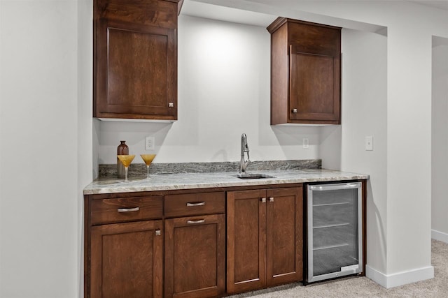 5096 N Milkweed Trl, Appleton, WI 54913 - bar featuring bar, light colored carpet, a sink, beverage cooler, and baseboards
