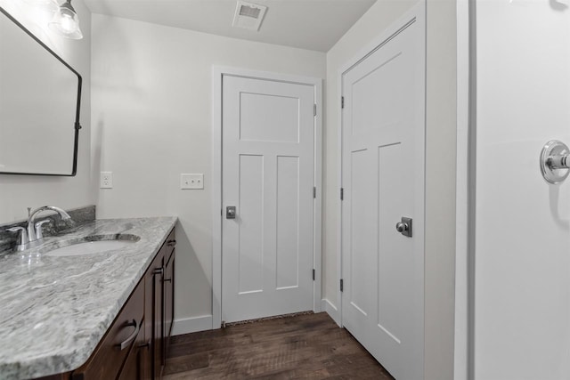 5096 N Milkweed Trl, Appleton, WI 54913 - bathroom with wood finished floors, vanity, baseboards, and visible vents