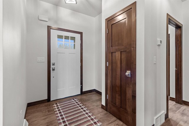 5096 N Milkweed Trl, Appleton, WI 54913 - entrance foyer featuring visible vents, baseboards, and wood finished floors