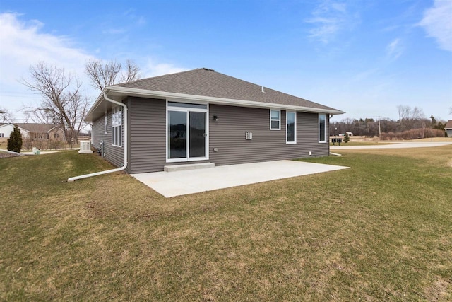 5096 N Milkweed Trl, Appleton, WI 54913 - rear view of property featuring a yard, a shingled roof, and a patio