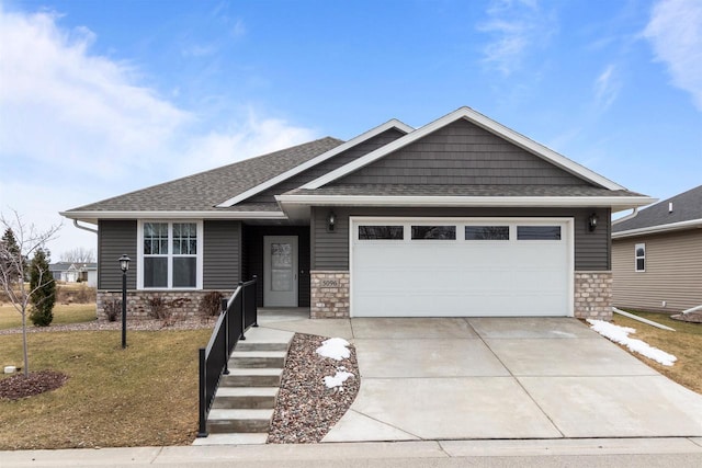 5096 N Milkweed Trl, Appleton, WI 54913 - craftsman inspired home with an attached garage, a shingled roof, stone siding, and driveway