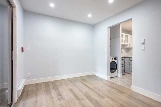 laundry room with washer / clothes dryer, baseboards, laundry area, light wood-style floors, and recessed lighting