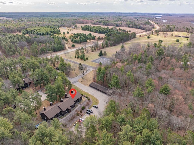 bird's eye view featuring a rural view and a wooded view