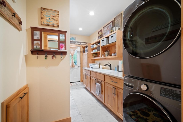 1979 9th Ave, Friendship, WI 53934 - washroom with stacked washer / drying machine, recessed lighting, a sink, light tile patterned flooring, and laundry area