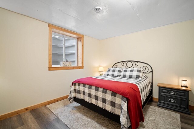 1979 9th Ave, Friendship, WI 53934 - bedroom featuring wood finished floors and baseboards
