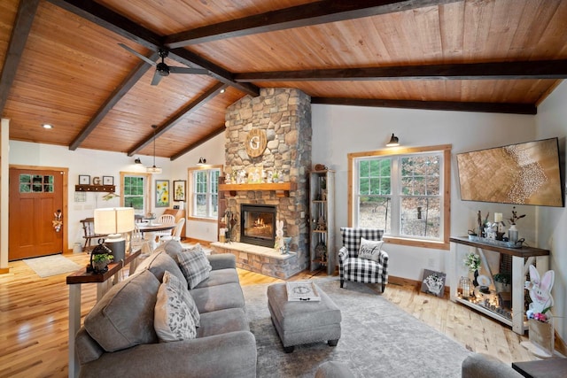 1979 9th Ave, Friendship, WI 53934 - living room featuring wood ceiling, ceiling fan, lofted ceiling with beams, baseboards, and wood finished floors