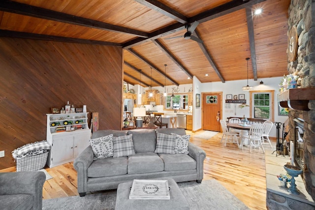 1979 9th Ave, Friendship, WI 53934 - living room with beam ceiling, wooden ceiling, wooden walls, and light wood-style flooring