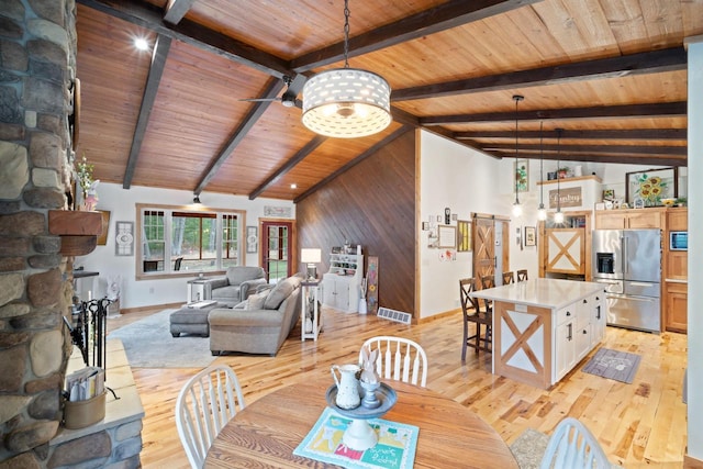 1979 9th Ave, Friendship, WI 53934 - dining room with lofted ceiling with beams, visible vents, wooden ceiling, and light wood-style floors