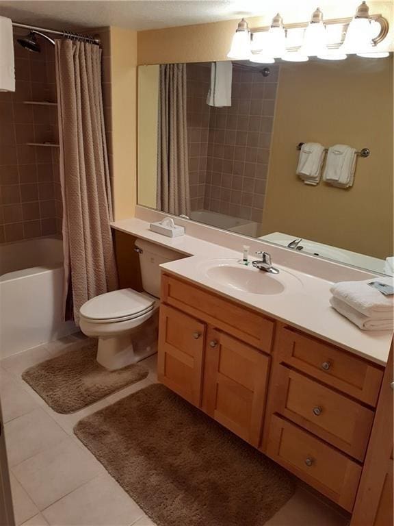2856 29th Ave Unit 110, Birchwood, WI 54817 - full bath featuring a notable chandelier, toilet, shower / tub combo with curtain, vanity, and tile patterned flooring