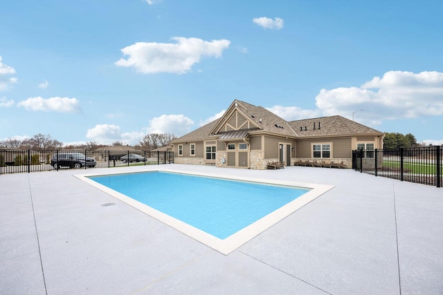view of pool with a fenced in pool, a patio, and fence