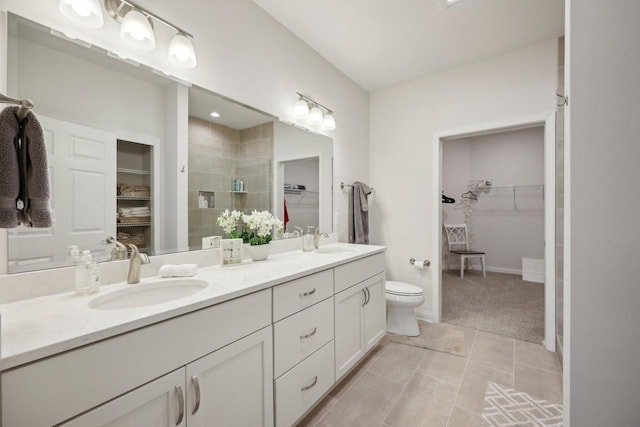 bathroom with a sink, tile patterned flooring, double vanity, and a stall shower