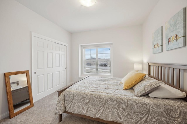 carpeted bedroom featuring a closet
